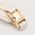 Load image into Gallery viewer, Bone Signature Harness buckle view on a pale warm-gray background