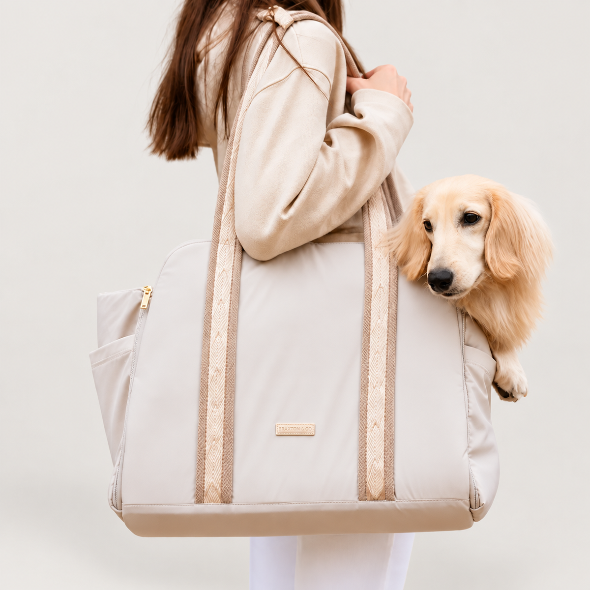 Convertible Carrier sand view on a pale warm-gray background