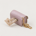 Load image into Gallery viewer, Waste Bag Holder dispensing view on a pale warm-gray background
