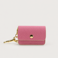 Load image into Gallery viewer, Pink Waste Bag Holder on a pale warm-gray background
